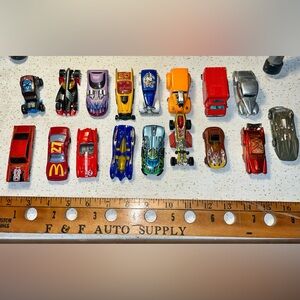 Lot of 17 vintage die-cast Hot Wheels toy cars.